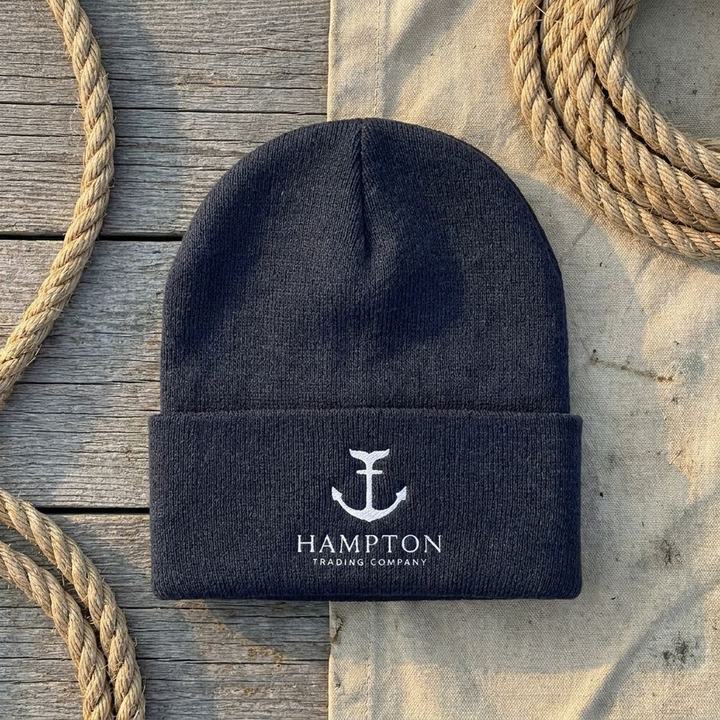Navy knit watch cap with the embroidered Hampton Trading Company mark on the cuff